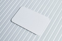 Blank white card on pattern glass