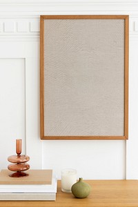 Blank picture frames hanging in a minimal living room