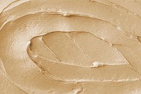 Brown frosting texture background close-up