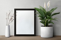 Dark modern picture frame on a shelf