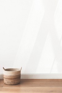 Rattan basket by a blank wall background