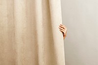 Beige curtain home decor, with female hand