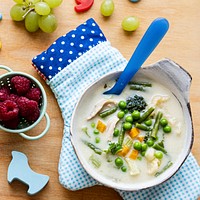 Kids healthy chicken soup with peas and carrots 