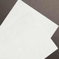 Blank white paper on brown background