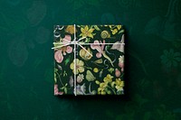 Floral gift box wrapped in vintage style flat lay