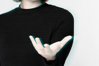 Glitching woman&rsquo;s hand background showing invisible object gesture digital remix