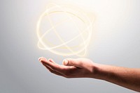 Atom hologram background showing on man&rsquo;s hand science technology remix