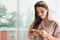 Smiling woman holding smartphone remixed media