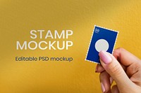 Postage stamp mockup psd in a hand