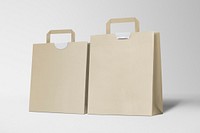 Paper shopping bags on gray background
