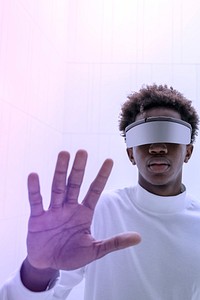 Man wearing smart glasses touching a virtual screen futuristic technology digital remix