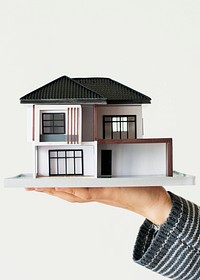 Hand presenting model house psd for home loan campaign