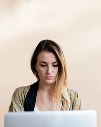 Business woman working on a laptop with design space