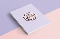 Purple notebook on pastel background