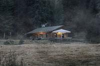 Cabin by a woods with mist overlay texture