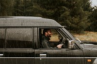 Man driving under the rain