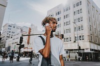 African American man chatting on a phone in the city