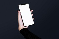 Hand holding blank smartphone screen with design space