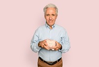 Senior man holding piggy bank for financial savings campaign