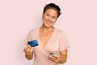 Cheerful shopaholic woman holding credit card cashless payment