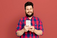 Bearded man texting on smartphone digital device
