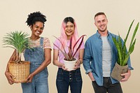 Happy plant parents holding their potted plants