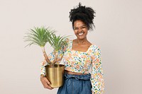 Asian plant parent holding potted agave