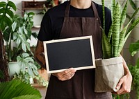 Small business owner holding an empty sign