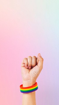 LGBTQ+ pride bracelet with fist in the air