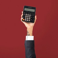 Hand holding calculator in finance concept