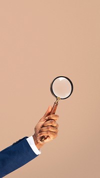 Magnifying glass research business symbol