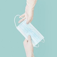 Hand giving mask Covid-19 prevention
