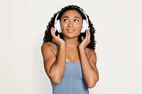 Woman with headphones, isolated on off white psd