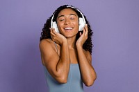 Woman listening to music through headphones