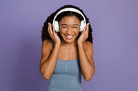 Woman listening to music through headphones