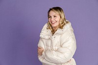 Blonde woman in white down jacket, winter outfit 