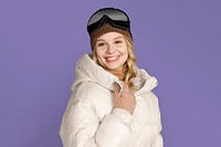 Happy woman with ski goggles, on purple background