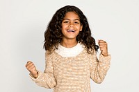 Little girl celebrating, isolated on off white psd