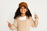 Girl giving thumbs up, isolated on off white psd
