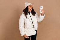 Happy woman in a video call, wearing winter clothes