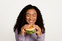 Woman eating hamburger for lunch psd