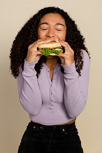 Woman enjoying a burger for lunch