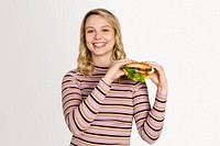 Happy woman eating a hamburger for lunch