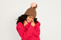 Little girl in knitted sweater, isolated on off white psd