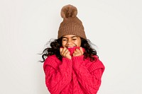 Cute little girl in winter clothes, isolated on off white