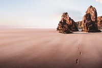 Beautiful beach scenery with footprints in the sand