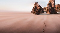 Beautiful beach scenery with footprints in the sand