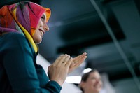 Ambassador arabian woman clapping her hands