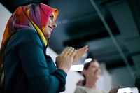 Ambassador arabian woman clapping her hands