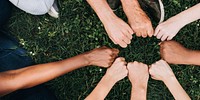 Diverse community with hands in a circle